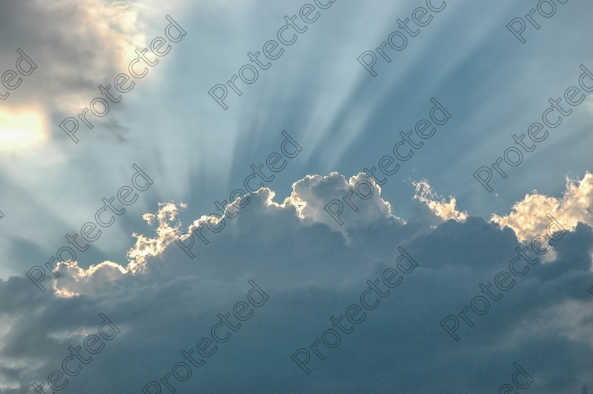 DSC 0274-(1)-final 
 Sun rays through clouds on blue sky 
 Keywords: black, blue, bright, climate, cloud, cloudy, course, danger, dark, darkness, dramatically, formation, gray, landscape, light, meteorology, nature, of, scene, sight, sky, spiritually, storm, stormy, summer, sun, sunbeam, thunder, thunderstorm, up, weather