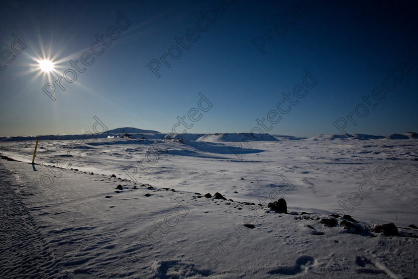 0304 Going South 
 Icelandic Landscape 
 Keywords: Snow, Landscape, Iceland, Sun, Sunlight, Winter, Sunny , Beauty In Nature, Clear Sky, Journey, Vacations, Travel Destinations, Tyre Track