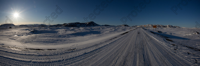 Panorama1 
 Snowy road in Iceland - panorama 
 Keywords: lue, centered composition, cloud, cloudscape, cold, copy space, country road, day, dirt, dramatic sky, extreme sports, extreme terrain, farm, frozen, grass, gravel, highway, hill, horizontal, iceland, landscape, leading line, light, mountain, mountain range, mountain road, mud, nobody, non-urban scene, open, outdoors, road, rolling landscape, rural scene, single lane road, single line, sky, snow, street, sun, sunlight, tire track, tranquil scene, travel, unpaved, vibrant color, wilderness area, winter
